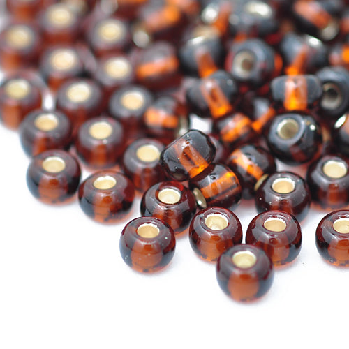 Preciosa Rocailles braun Silbereinzug / Ø 4,5mm (5/0) / 15gr.