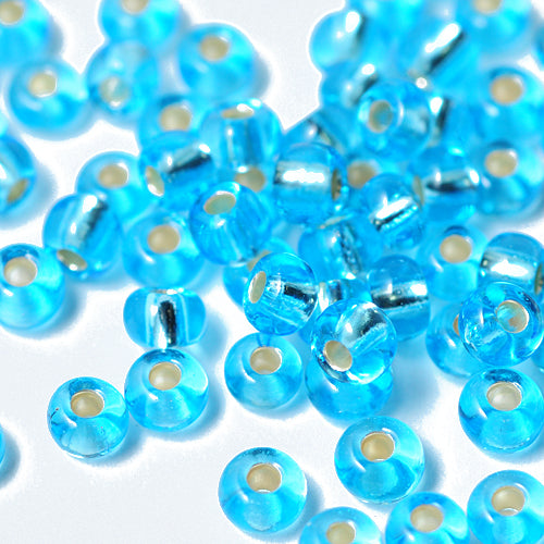 Preciosa Rocailles aqua Silbereinzug / Ø 4,5mm (5/0) / 15gr.