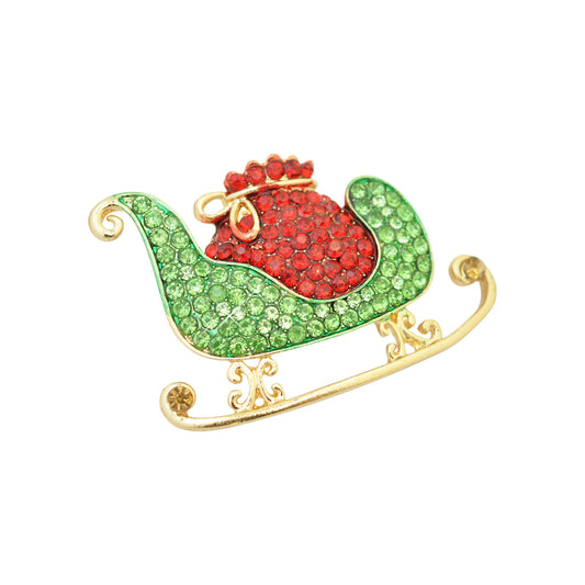 Weihnachtsbrosche Schlitten Strass  / goldfarben / 30x45mm